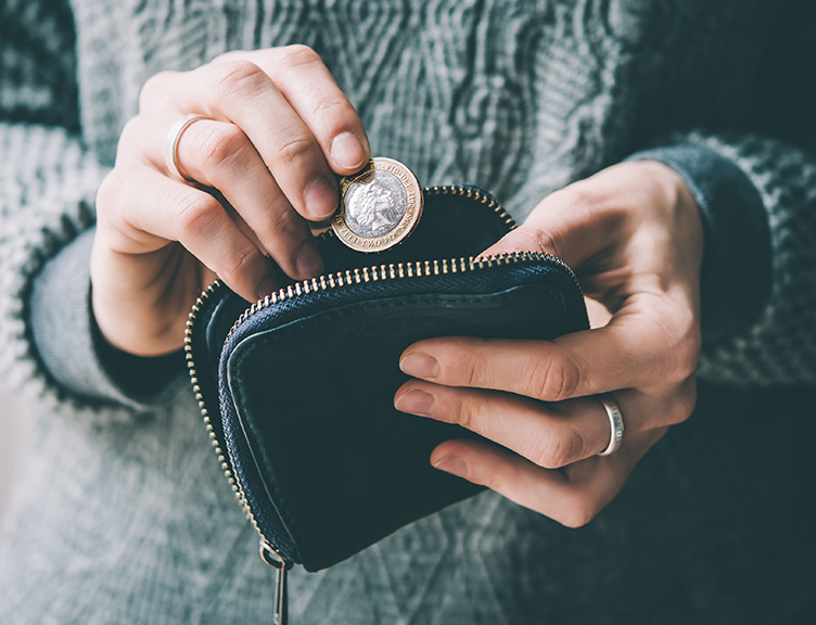 Person taking coin out of purse